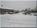 Junction of a snowy Kingsworthy Road and Blendworth Crescent