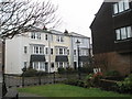 Pastel coloured houses as seen from River Road Gardens