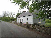 G9204 : Cottage near Shanballybaun Lough by Oliver Dixon
