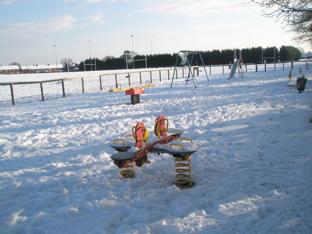 An empty playpark within a snowy Hooks Lane Rec