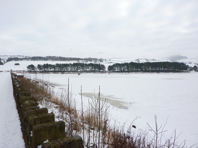A frozen and snow covered Earnsdale Reservoir