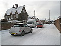 Cars heading west down a treacherous Dysart Avenue