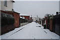 Cobbled back St in the snow off Grange Rd