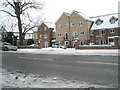 Looking across a snowy Havant Road towards Nightingale Court