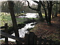 Tributary of the River Stor running past private pond