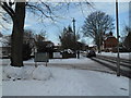 Approaching the junction of a snowy Wade Court Road into Emsworth Road