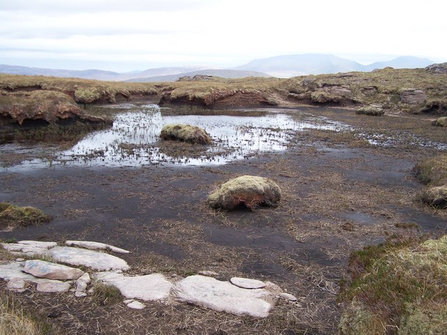 Peaty pool on the top of the Bealach Coire a' Chuidhe