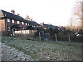 Rear of houses in Sickle Road as seen from the  path linking King