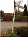 Sutton Poyntz: signpost and telephone box