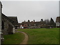 Approaching the south porch at Holy Cross, Binsted