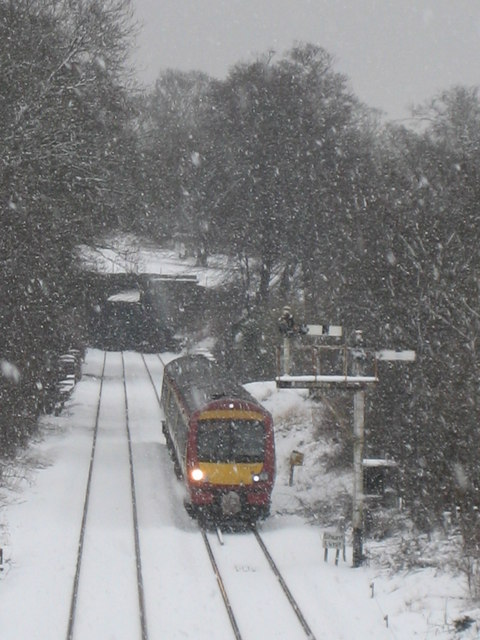 Dunblane in Winter: The train from Glasgow waits to enter the station.