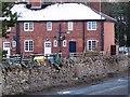 An isolated row of houses, at right angles to Whipperdale Bank