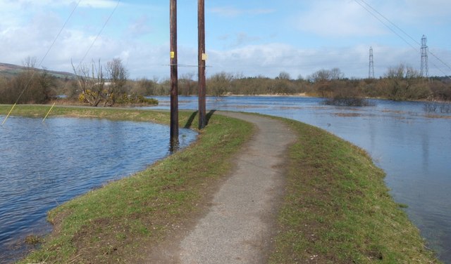 Cycle path crossing flooded field