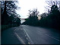 View up Egham Hill towards the Royal Holloway footbridge