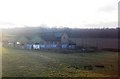 Well graffitied farm building near Frant Station