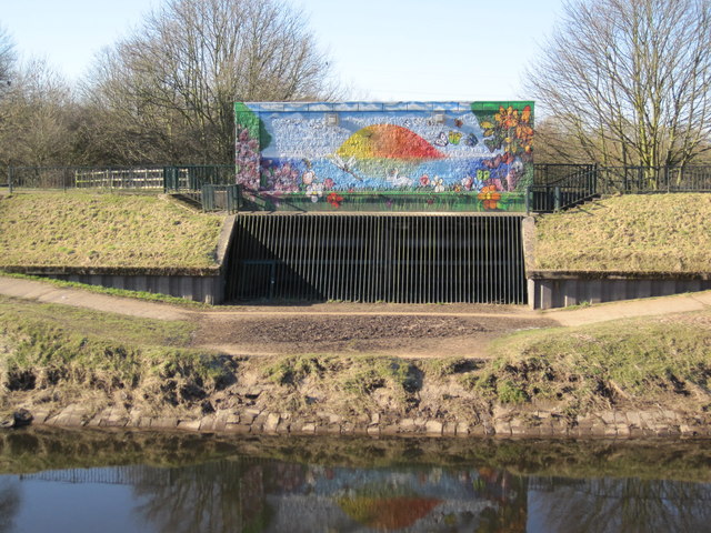 Brightly decorated flood defence works.