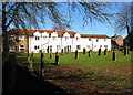 TF6616 : Cottages adjoining St Mary's churchyard by Evelyn Simak