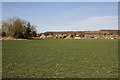 Field and the backs of houses in Oakgrove Gardens