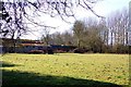 Looking over a field to Medley Manor Farm