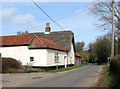 Rocklands Road past cottages in Shropham