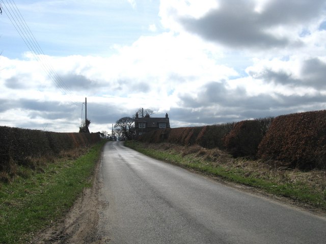 Minor road heading for cottages at Roxburgh Barns