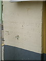 Foundation stone and benchmark on Theatr Gwaun, Fishguard