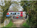 Train on the level crossing near the Oxford Canal