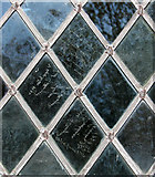 TF5414 : St Lawrence's church in Tilney St Lawrence - graffiti in window glass by Evelyn Simak