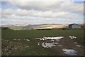 Puddles in the field but sun on the moors