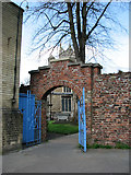 TF4609 : Doorway to St Peter's churchyard by Evelyn Simak