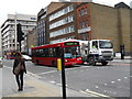 TQ3381 : Shoreditch bound bus in Aldgate High Street by Basher Eyre