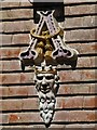 One of four decorative ceramic heads on the facade of the Nevill Arms and Gun at Eridge Green