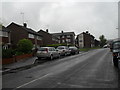 Approaching the junction of  Bustice Lane and Rectory Farm Road