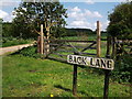 Gate and road name sign, Back Lane, Long Compton