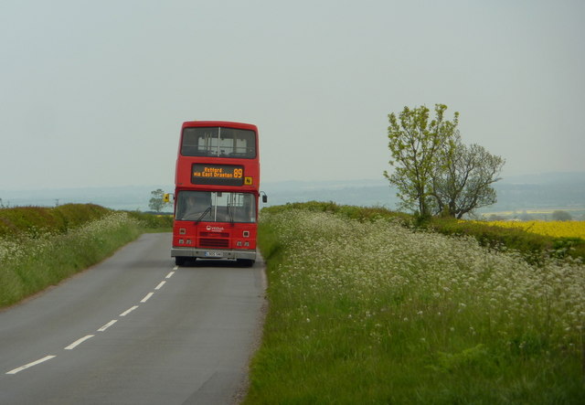 Country road with double decker bus