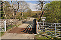 Cattle grid and bridge at the end of the public road at Ballimore