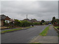 Approaching the junction of  Greentrees Crescent and Cokeham Gardens