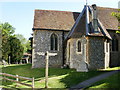 Public footpath sign in front of a church