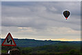 SK2255 : Hot air balloon from Tissington approaching Longcliffe by Mick Lobb