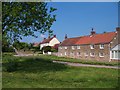 Houses by the green at Oulston