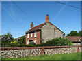 Flint and brick cottage in Horningtoft