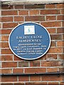 Blue plaque on the Almshouses