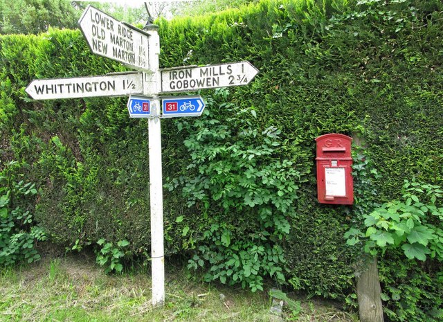 Postbox and Road sign in Hindford