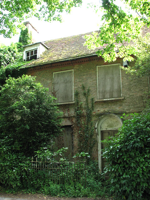 Overgrown and boarded-up