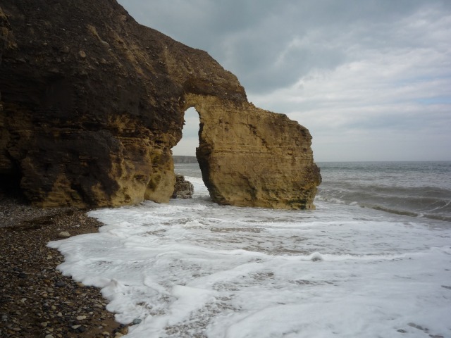 Sea washing through a sea arch