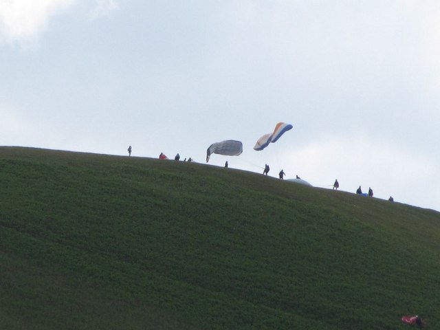 Paragliders on the hillside