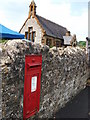 GR post box in wall adjacent to Combrook Village Hall