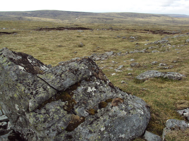 Open moorland featuring foreground boulder