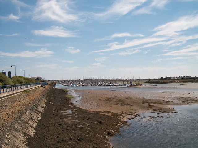 View south across exposed mud towards The Marina
