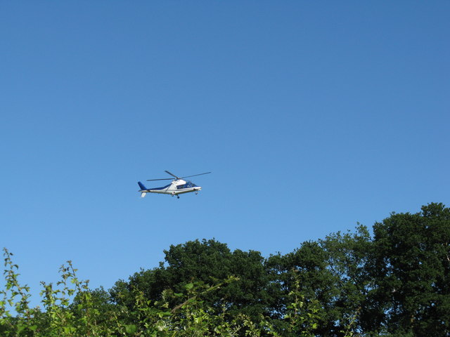 Helicopter over Smokyhouse Lane on approach to Polo ground